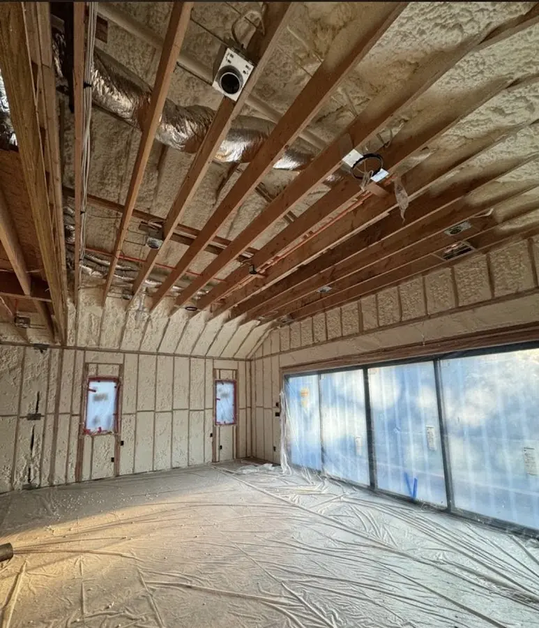 Interior walls and ceiling insulated with spray foam during new construction in Wilna